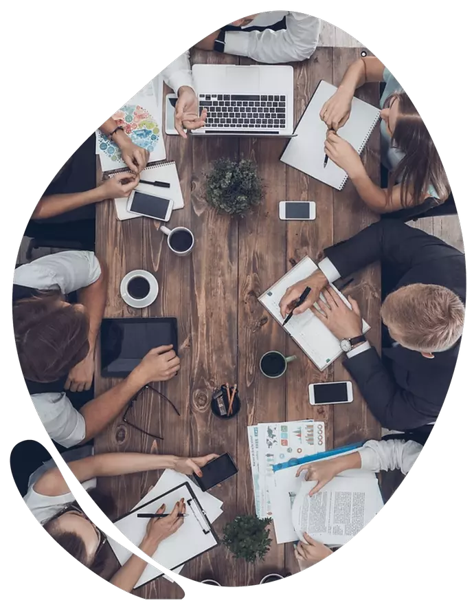 picture of a business meeting using a blob shape as its frame